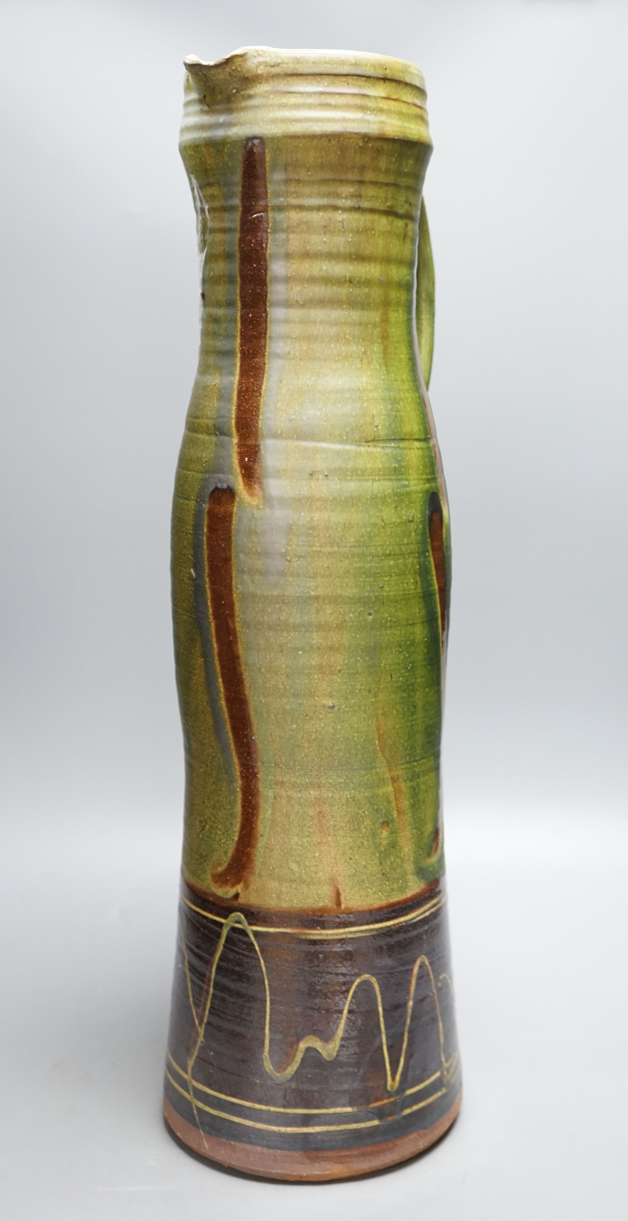 Clive Bowen (b.1943), a tall green glazed and brown slip decorated ewer, 59cm